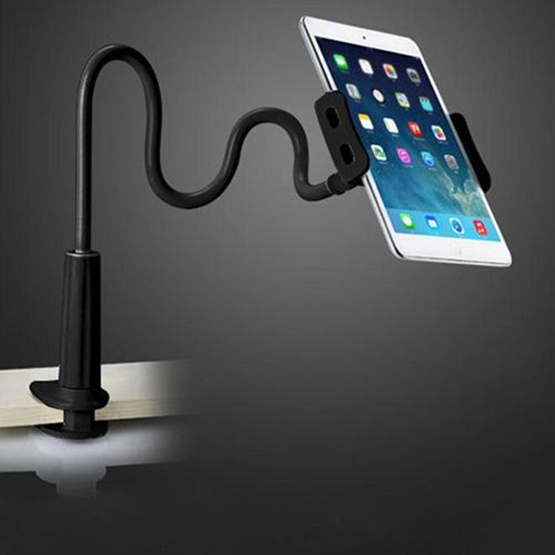 Black flexible phone stand clamped to a desk in use; device not included