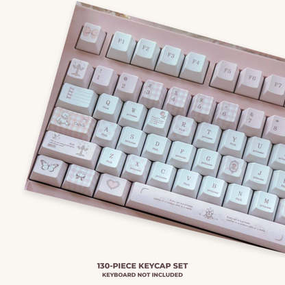 Pink and white love-themed PBT keycaps installed for display; 130-piece keycap set only, keyboard not included.